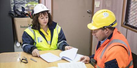 Man and woman at table with paperwork