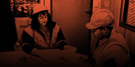 Man and woman at table with paperwork